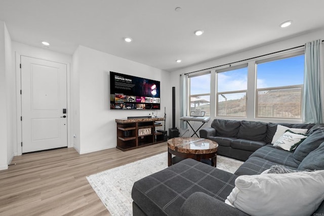 living room featuring light hardwood / wood-style flooring and indoor bar