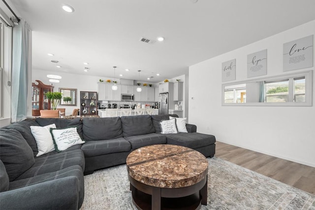 living room featuring light wood-type flooring