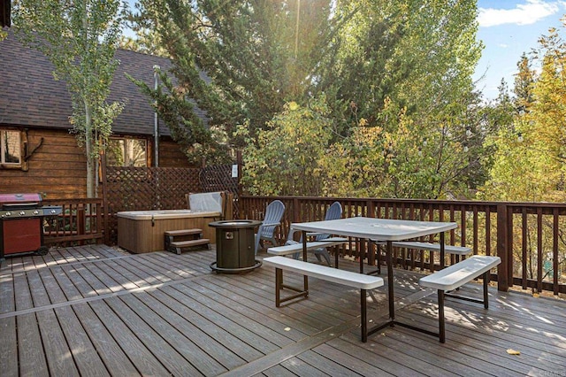 deck with a grill and a hot tub