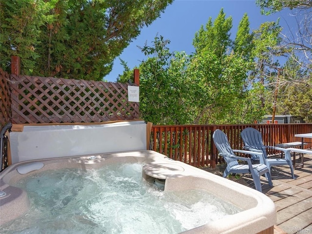 deck featuring a hot tub