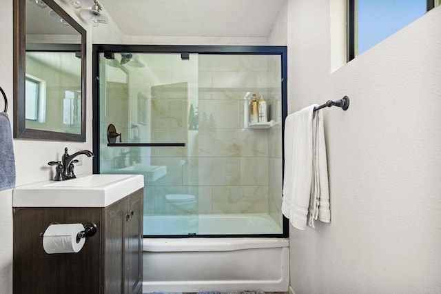 bathroom featuring vanity and combined bath / shower with glass door