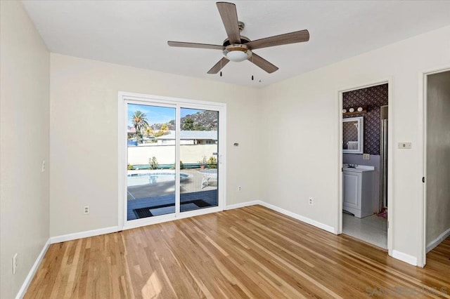 spare room with hardwood / wood-style floors and ceiling fan