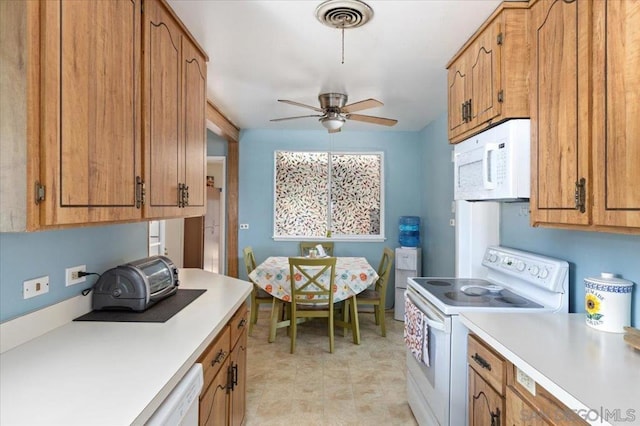 kitchen featuring ceiling fan and white appliances