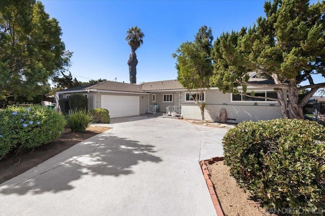 single story home with a garage