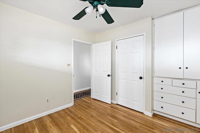 unfurnished bedroom featuring ceiling fan and light wood-type flooring