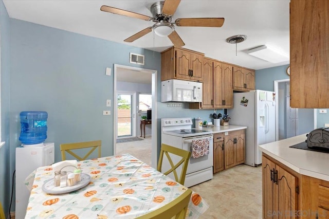 kitchen featuring ceiling fan and white appliances