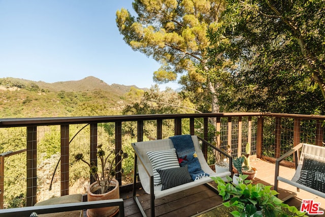 balcony featuring a mountain view