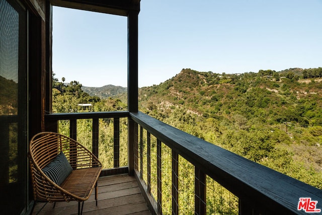 balcony featuring a mountain view