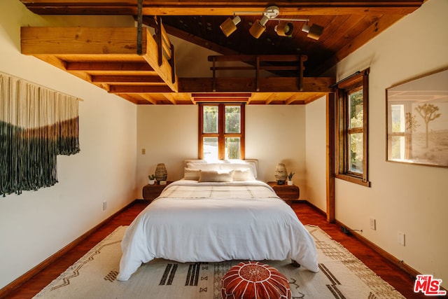 bedroom featuring wood ceiling, wood-type flooring, and beam ceiling