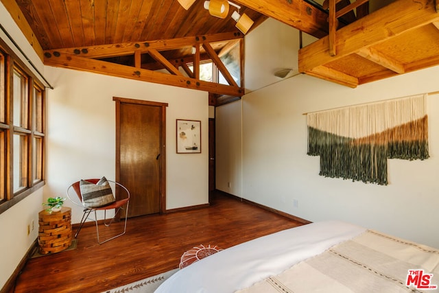 bedroom with dark wood-type flooring, vaulted ceiling with beams, and wooden ceiling