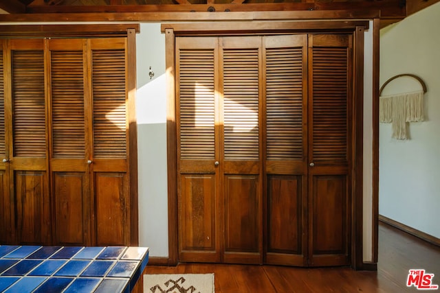 interior details featuring hardwood / wood-style flooring