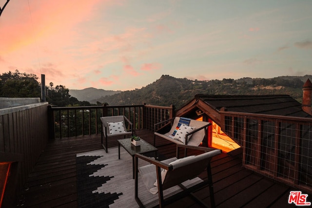 deck at dusk with a mountain view