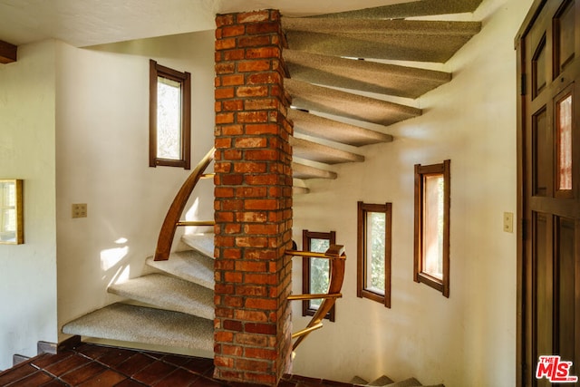 stairway with beam ceiling