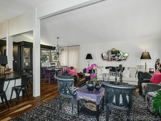 living room featuring dark wood-type flooring and a chandelier