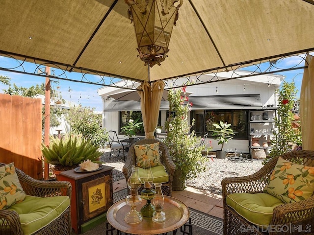 view of patio with a gazebo and an outdoor hangout area