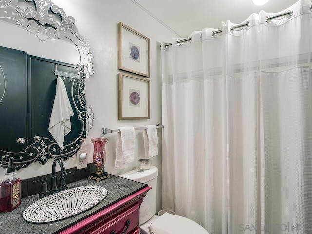 bathroom featuring vanity and toilet