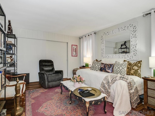 bedroom featuring wood-type flooring and a closet