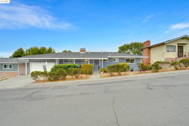 ranch-style house featuring a garage