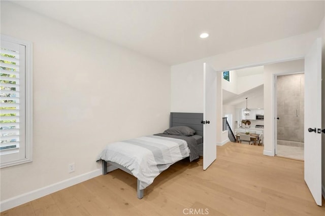 bedroom with hardwood / wood-style flooring