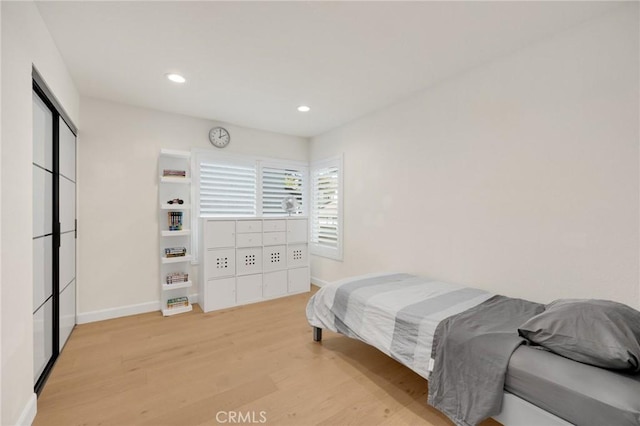 bedroom featuring light hardwood / wood-style floors