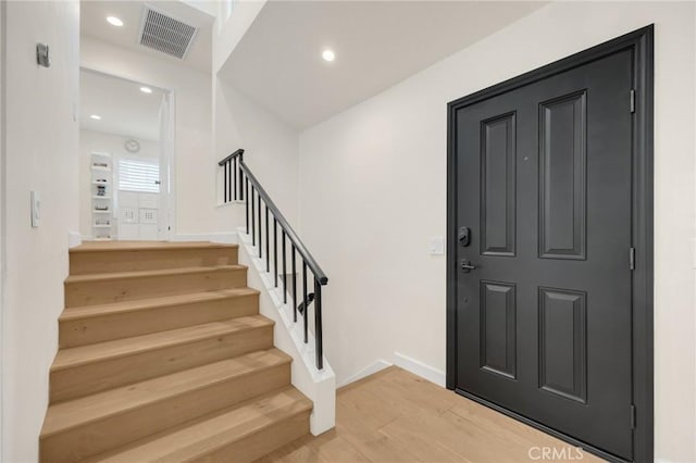 entrance foyer featuring hardwood / wood-style flooring