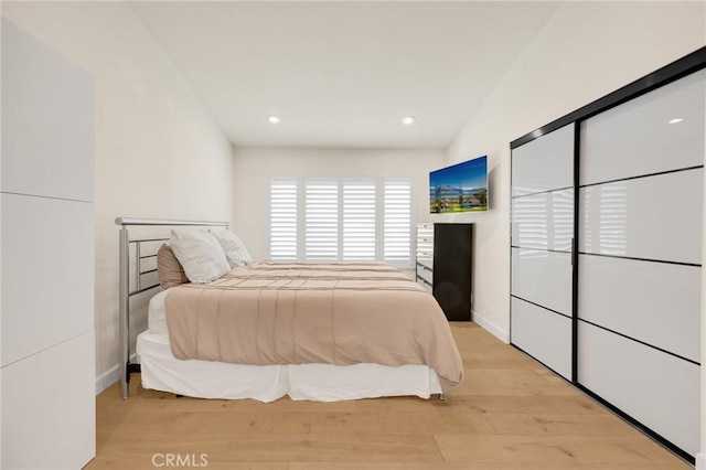 bedroom with light hardwood / wood-style flooring