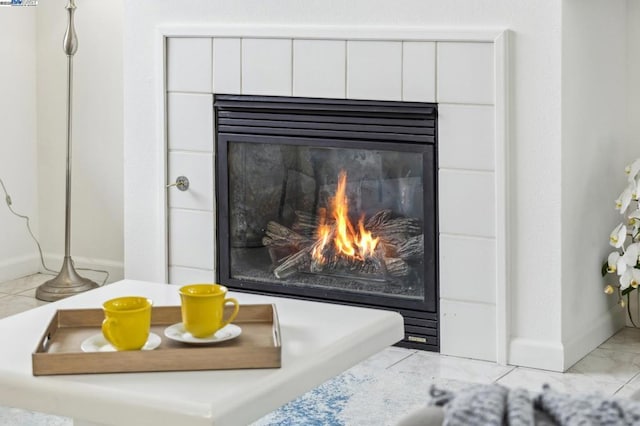 details with a tile fireplace