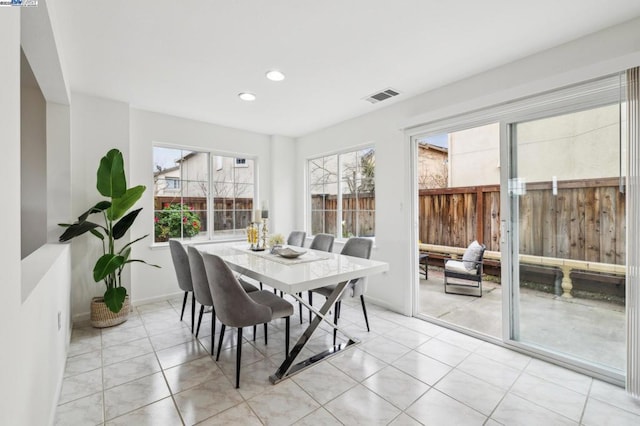 dining area featuring light tile patterned flooring