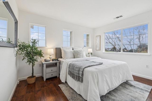 bedroom featuring dark wood-type flooring