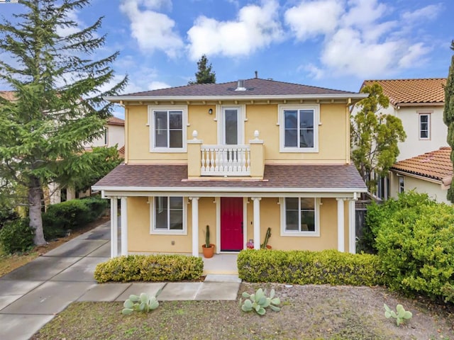 view of front of property with a balcony