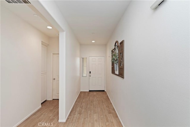 corridor featuring light hardwood / wood-style flooring