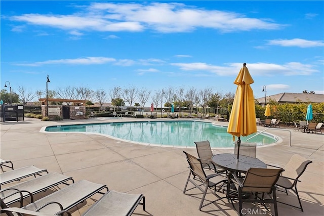 view of swimming pool with a patio