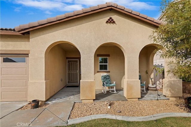 view of exterior entry featuring a garage