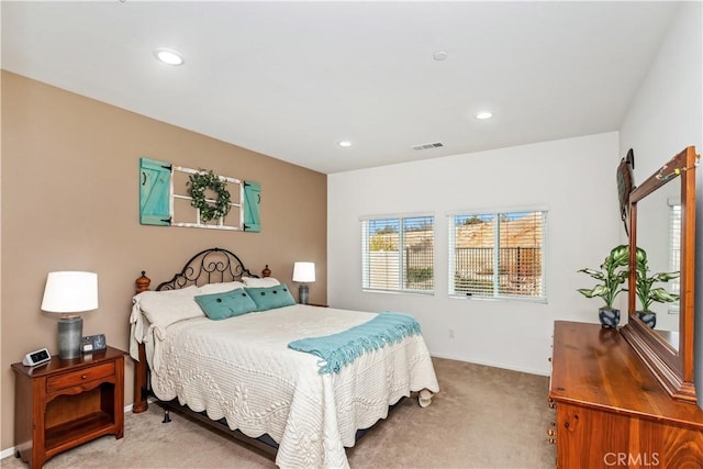 bedroom featuring light colored carpet