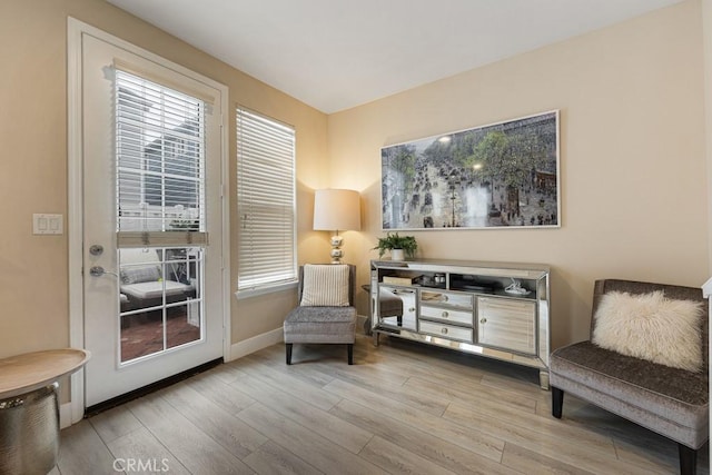 sitting room featuring light hardwood / wood-style flooring