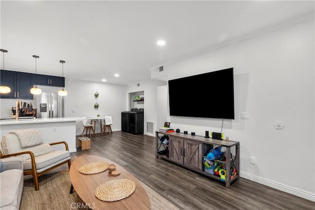 living room with dark hardwood / wood-style floors