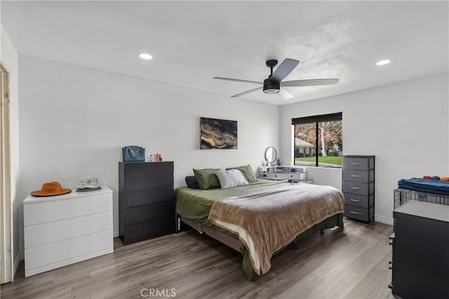 bedroom featuring ceiling fan and wood-type flooring