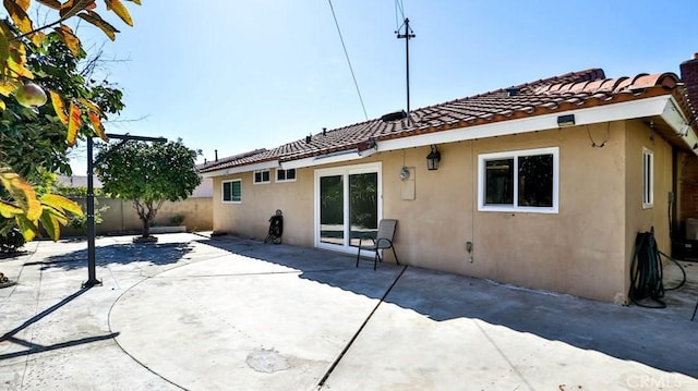 rear view of house featuring a patio area