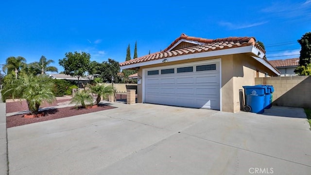 view of side of property with a garage