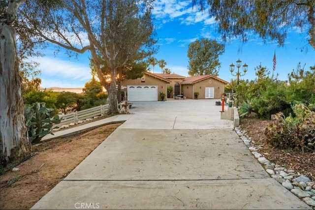 ranch-style house featuring a garage