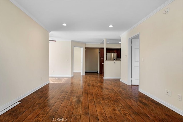 unfurnished room featuring dark hardwood / wood-style flooring and crown molding