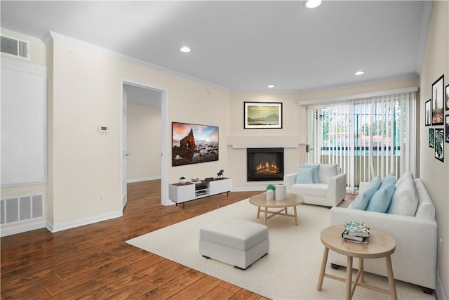 living room with hardwood / wood-style floors and ornamental molding