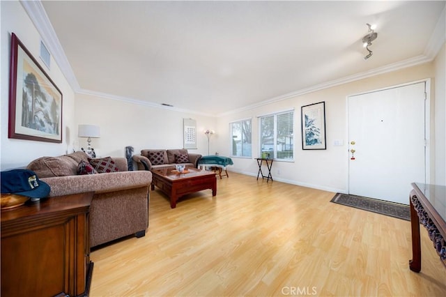 living room featuring hardwood / wood-style flooring and crown molding