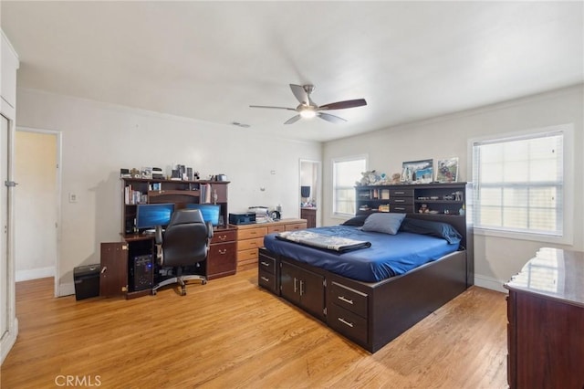 bedroom featuring light hardwood / wood-style floors and ceiling fan