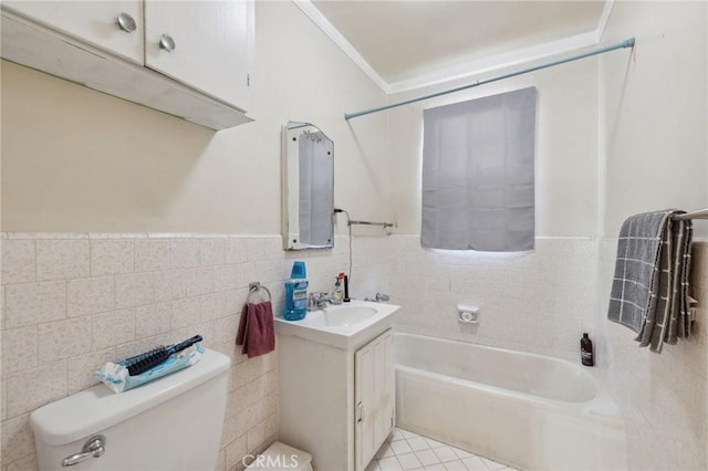 full bathroom with toilet, tub / shower combination, tile walls, vanity, and tile patterned flooring