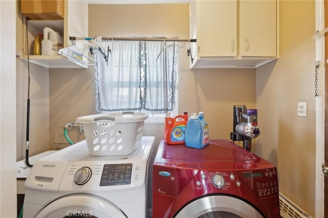 laundry room featuring cabinets, independent washer and dryer, and a baseboard radiator