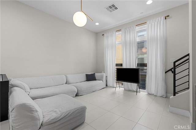 living room with light tile patterned flooring