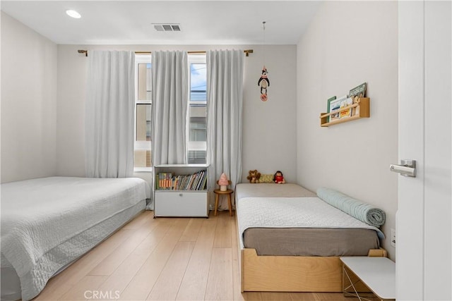 bedroom with hardwood / wood-style flooring