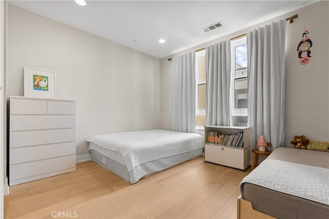 bedroom featuring light hardwood / wood-style floors