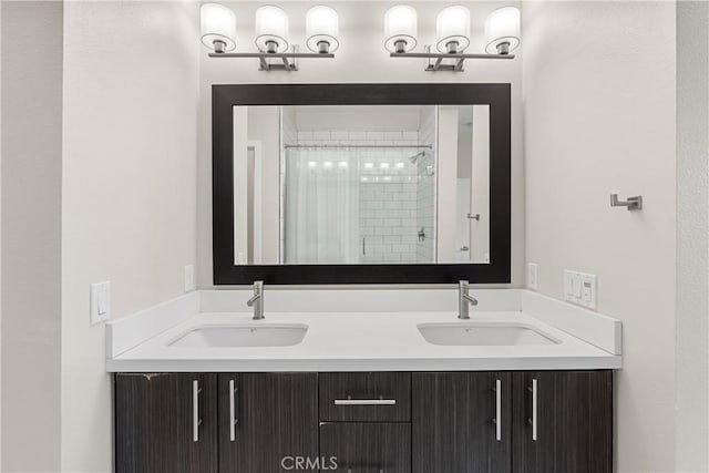 bathroom featuring vanity and a shower with shower door